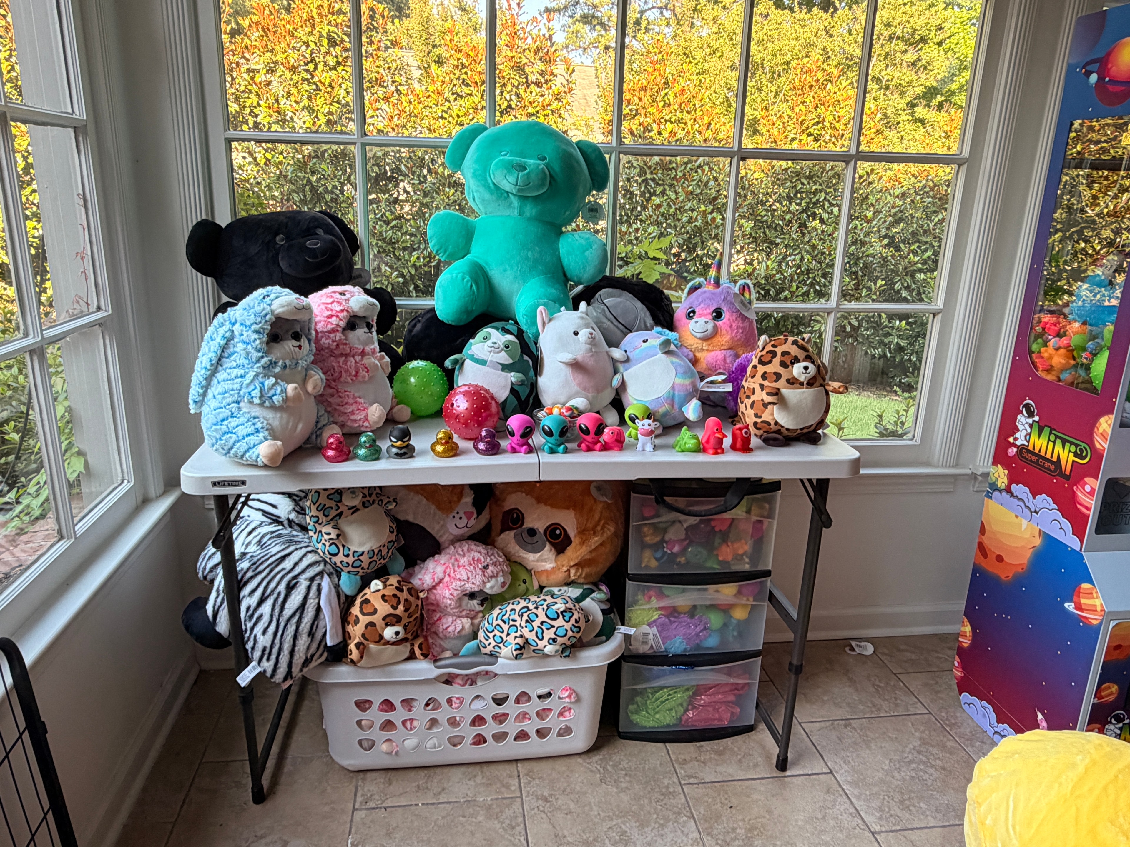 Full display of plush toys and prizes on a table